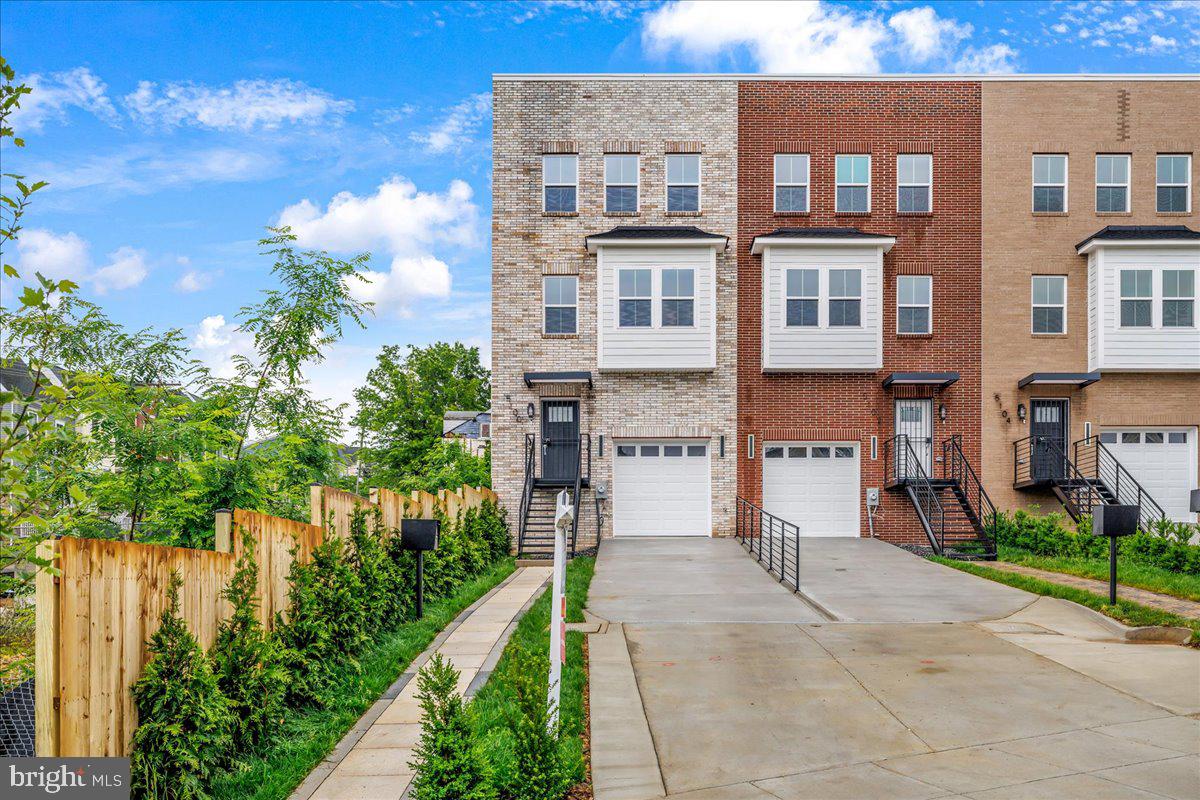 a view of a brick building next to a yard