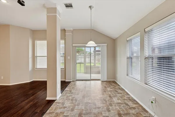 a view of a room with a large windows