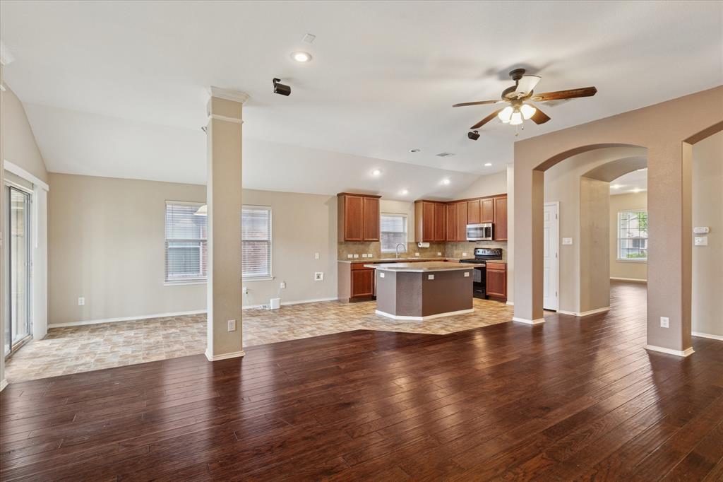 9308 Comanche Ridge Drive Fort Worth, TX 76131 - Photo 6 of 15 a view of a kitchen with cabinets and wooden floor