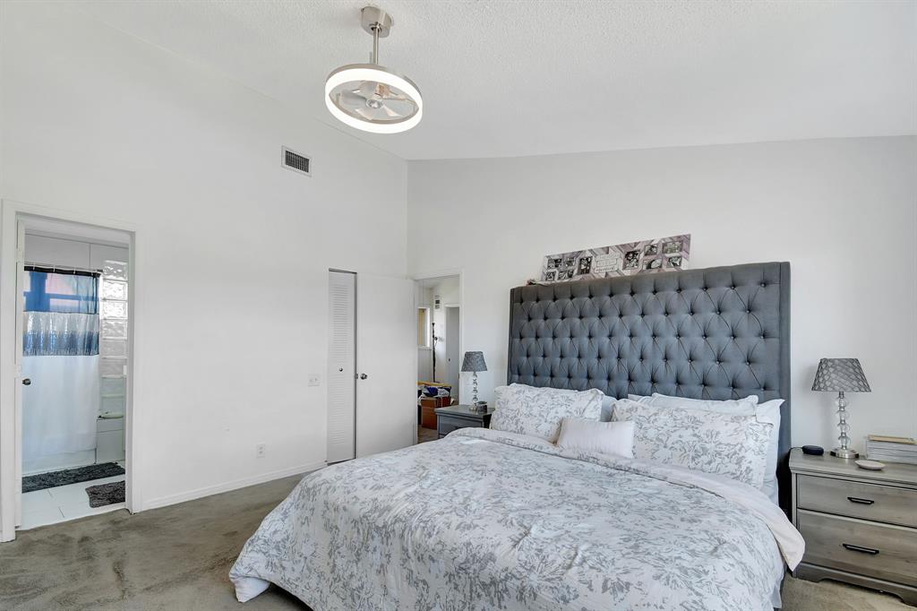 2420 Southwest 80th Terrace Miramar, FL 33025 - Photo 13 of 30 a bedroom with a bed and dresser