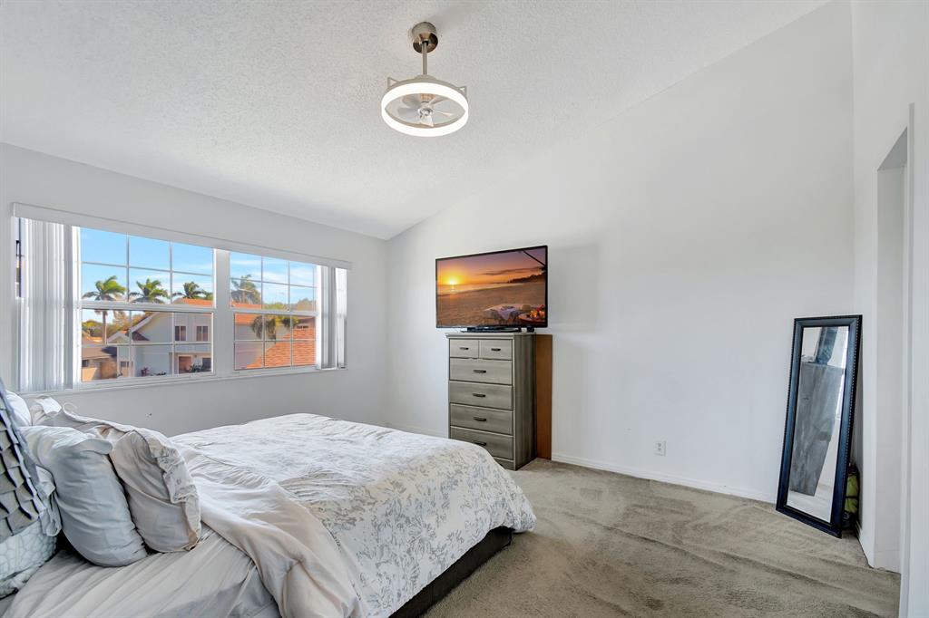 2420 Southwest 80th Terrace Miramar, FL 33025 - Photo 14 of 30 a bedroom with a bed and a window