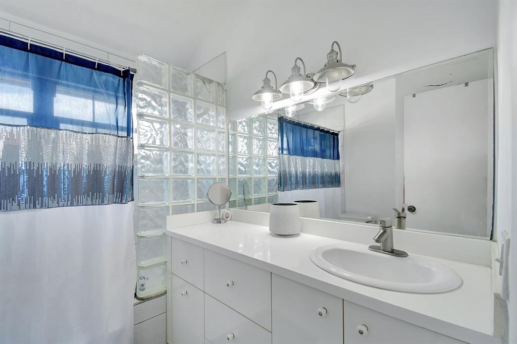 2420 Southwest 80th Terrace Miramar, FL 33025 - Photo 15 of 30 a bathroom with a sink and a mirror