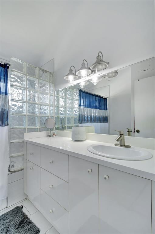 2420 Southwest 80th Terrace Miramar, FL 33025 - Photo 17 of 30 a bathroom with a sink double vanity and a mirror
