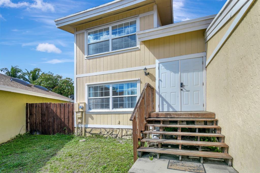 2420 Southwest 80th Terrace Miramar, FL 33025 - Photo 2 of 30 a front view of a house with a yard