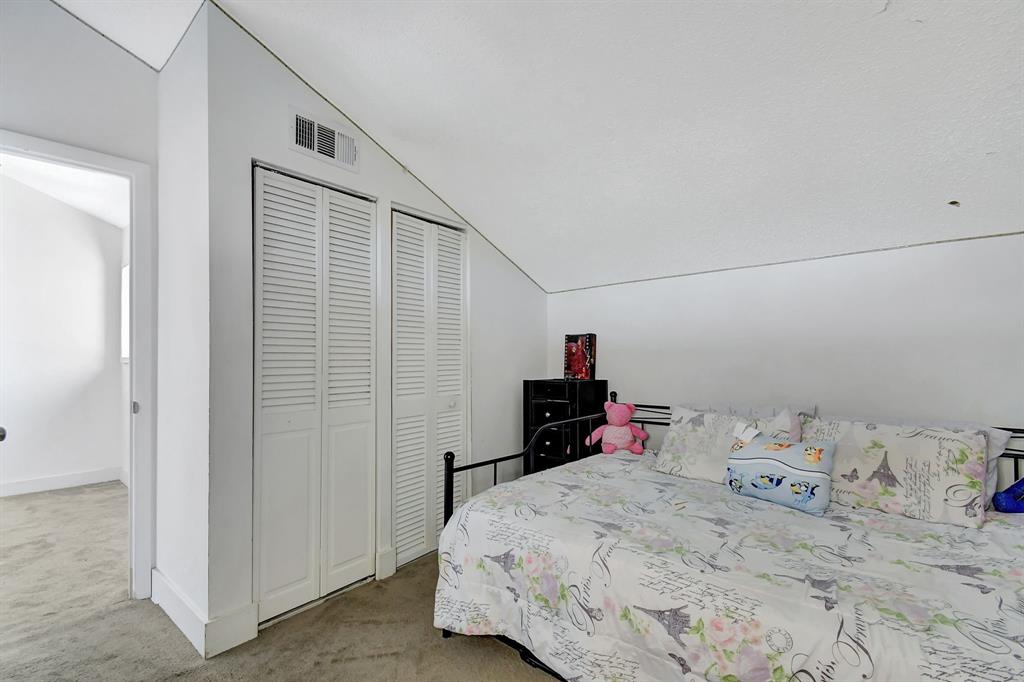 2420 Southwest 80th Terrace Miramar, FL 33025 - Photo 21 of 30 a bedroom with a bed and a closet
