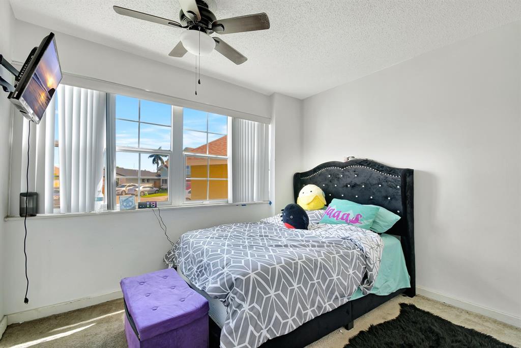 2420 Southwest 80th Terrace Miramar, FL 33025 - Photo 22 of 30 a bedroom with a bed and window