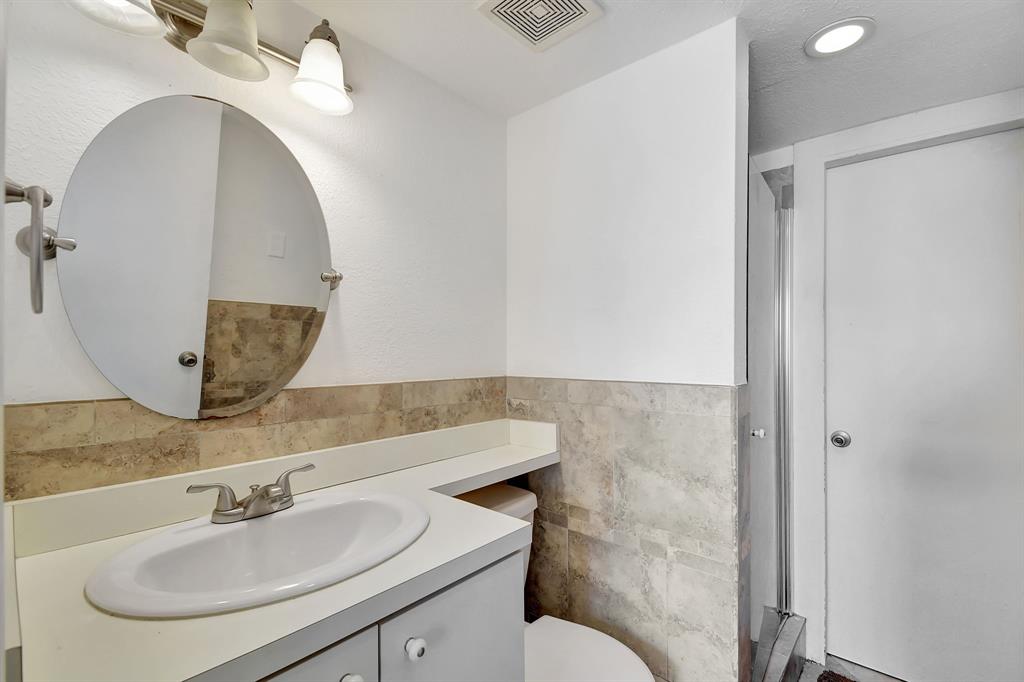 2420 Southwest 80th Terrace Miramar, FL 33025 - Photo 24 of 30 a bathroom with a sink and a mirror