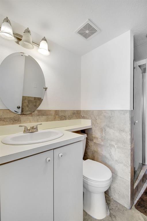 2420 Southwest 80th Terrace Miramar, FL 33025 - Photo 25 of 30 a bathroom with a toilet sink and mirror