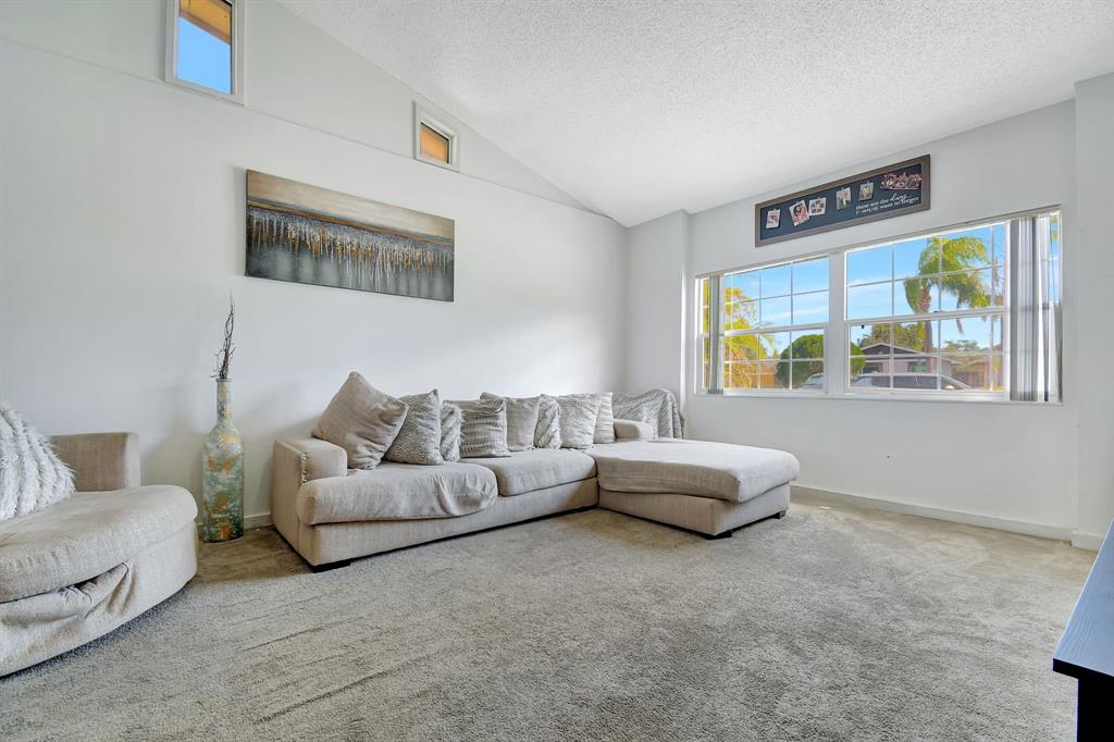 2420 Southwest 80th Terrace Miramar, FL 33025 - Photo 4 of 30 a living room with furniture and a window