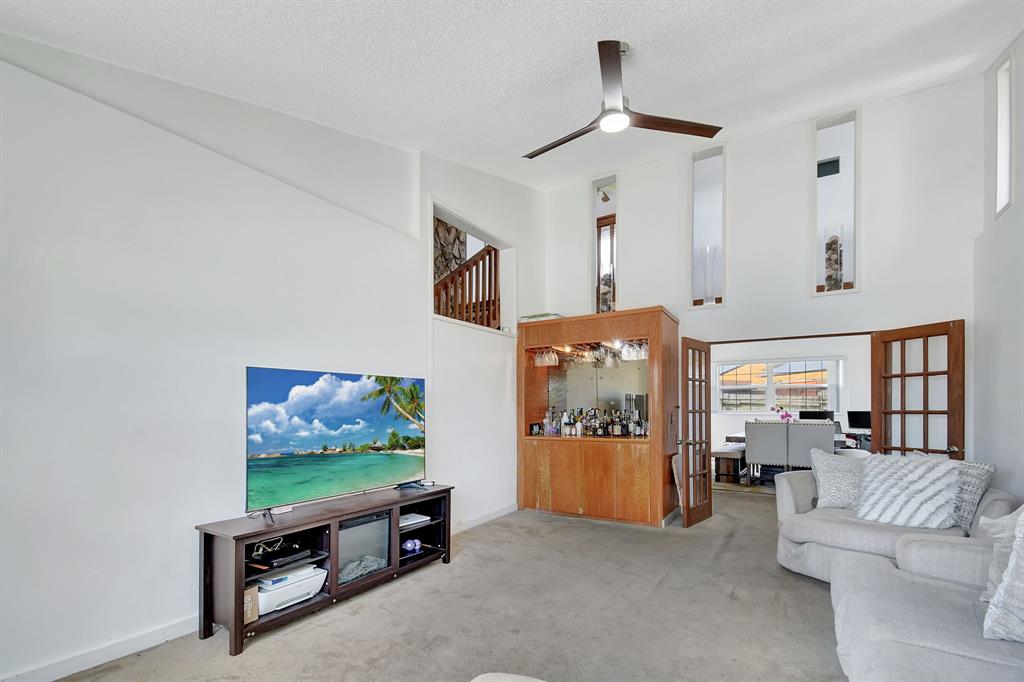2420 Southwest 80th Terrace Miramar, FL 33025 - Photo 6 of 30 a living room with furniture and a flat screen tv