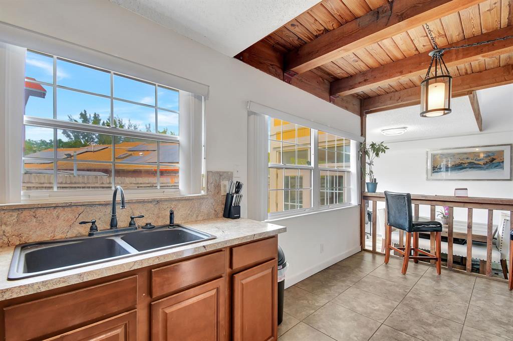 2420 Southwest 80th Terrace Miramar, FL 33025 - Photo 10 of 30 a kitchen filled a sink and a window