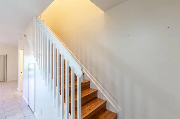 a view of hallway with wooden floor