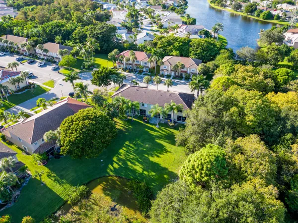 an aerial view of a house with yard swimming pool and outdoor seating