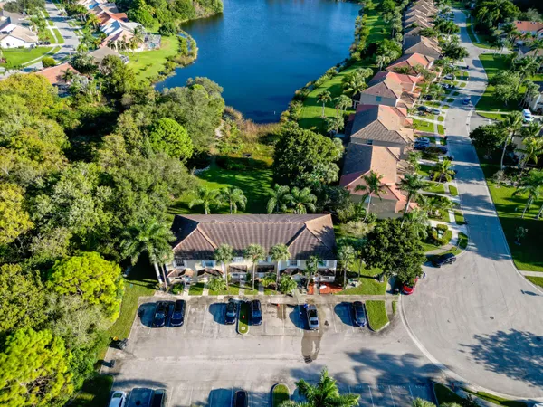 an aerial view of a houses with a lake view