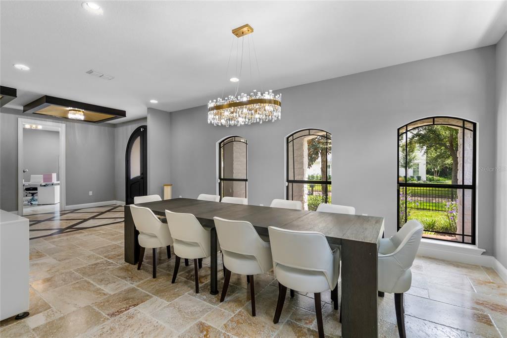 1451 Lyndale Boulevard Winter Park, FL 32789 - Photo 30 of 89 a view of a dining room with furniture and a chandelier