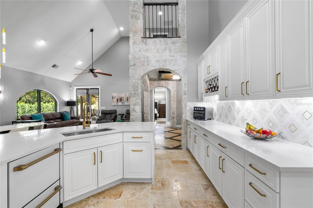 1451 Lyndale Boulevard Winter Park, FL 32789 - Photo 37 of 89 a large white kitchen with lots of counter space cabinets and appliances