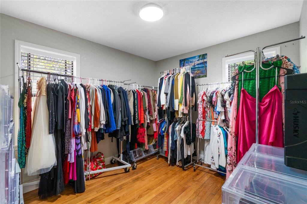 1451 Lyndale Boulevard Winter Park, FL 32789 - Photo 83 of 89 a view of a walk in closet with clothes
