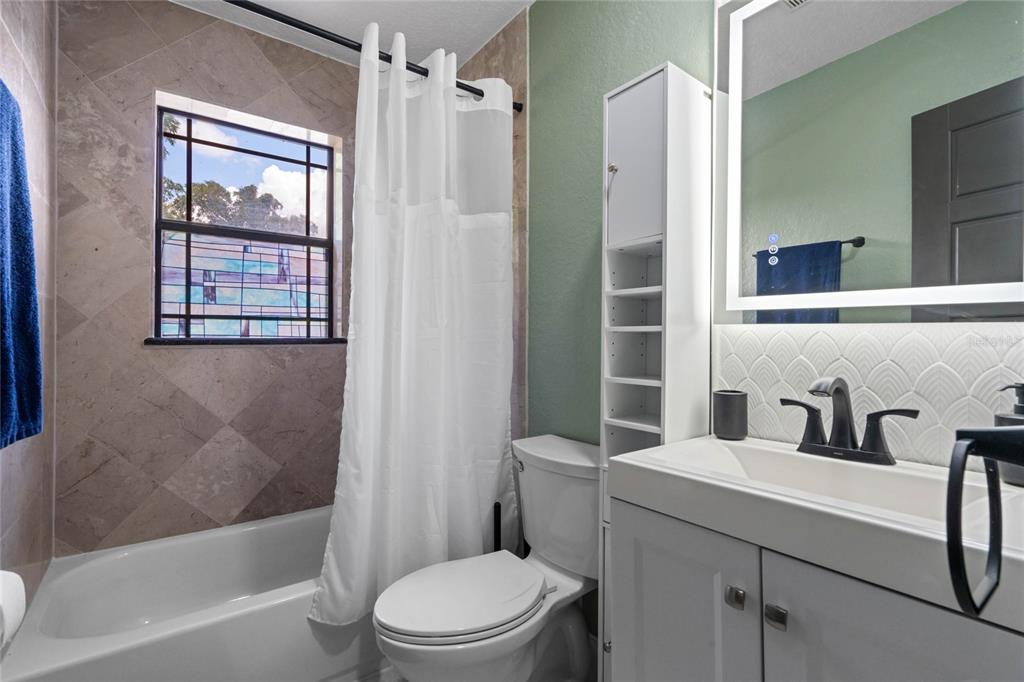 1451 Lyndale Boulevard Winter Park, FL 32789 - Photo 84 of 89 a bathroom with a sink toilet and shower