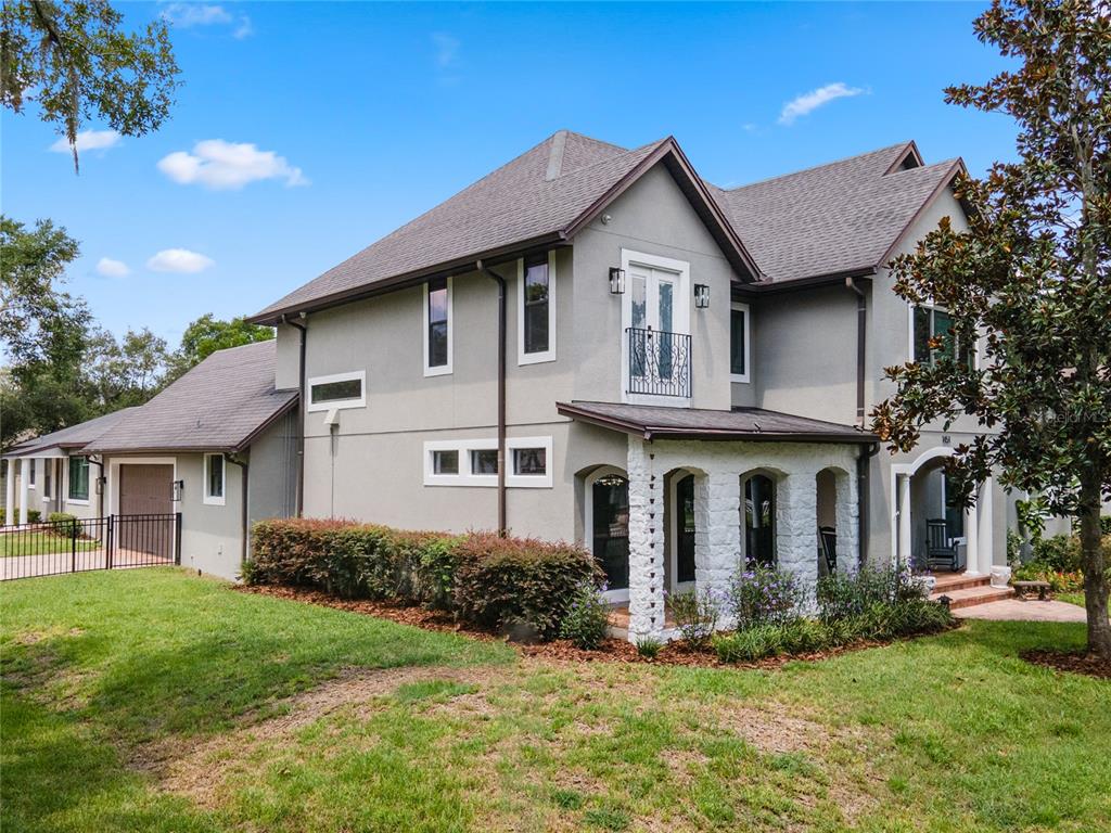 1451 Lyndale Boulevard Winter Park, FL 32789 - Photo 10 of 89 a front view of a house with a yard and garage
