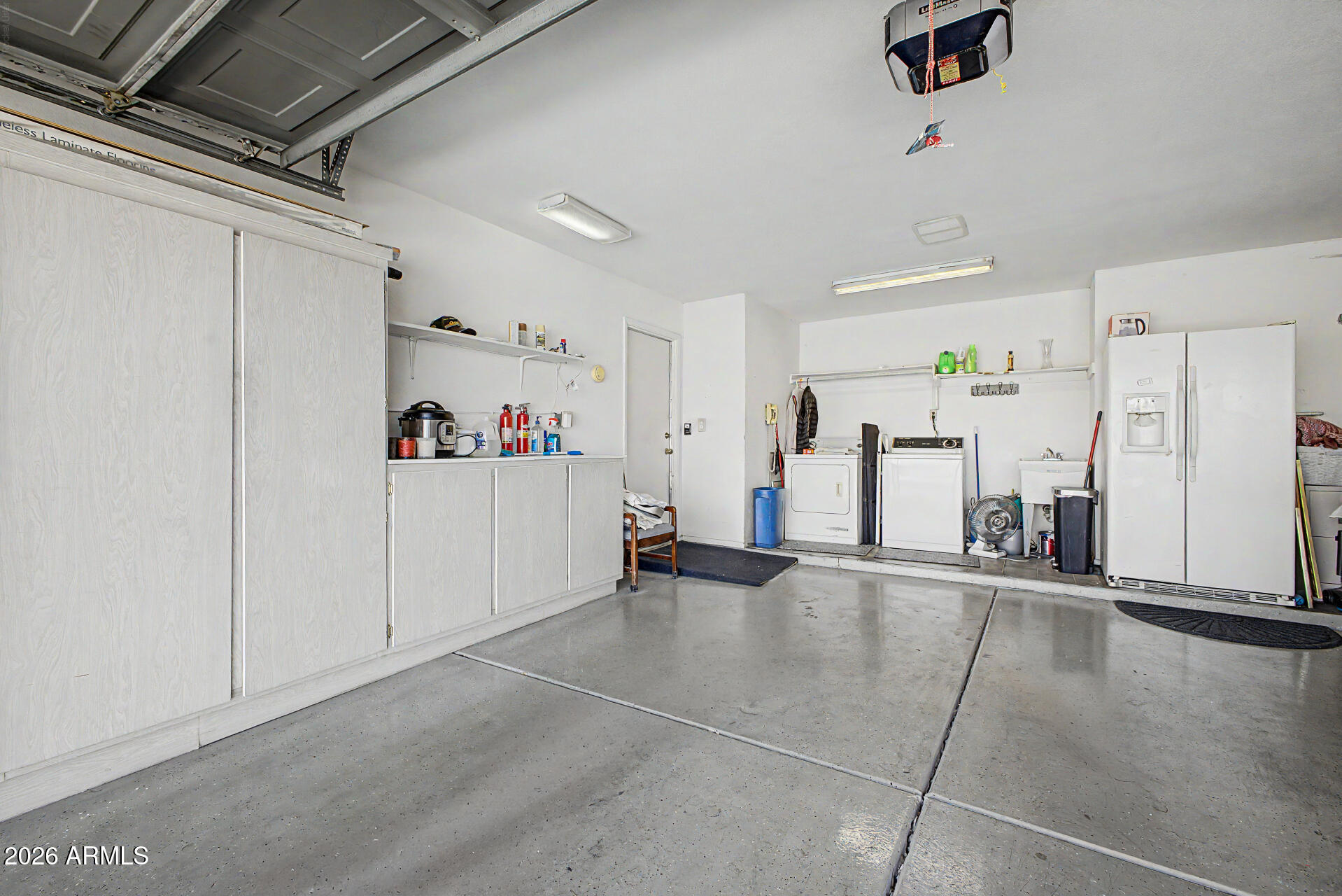 2659 West Hearn Road Phoenix, AZ 85023 - Photo 21 of 25 a view of a room with gym equipment and refrigerator