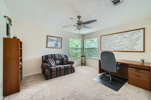 a work room with furniture and a window