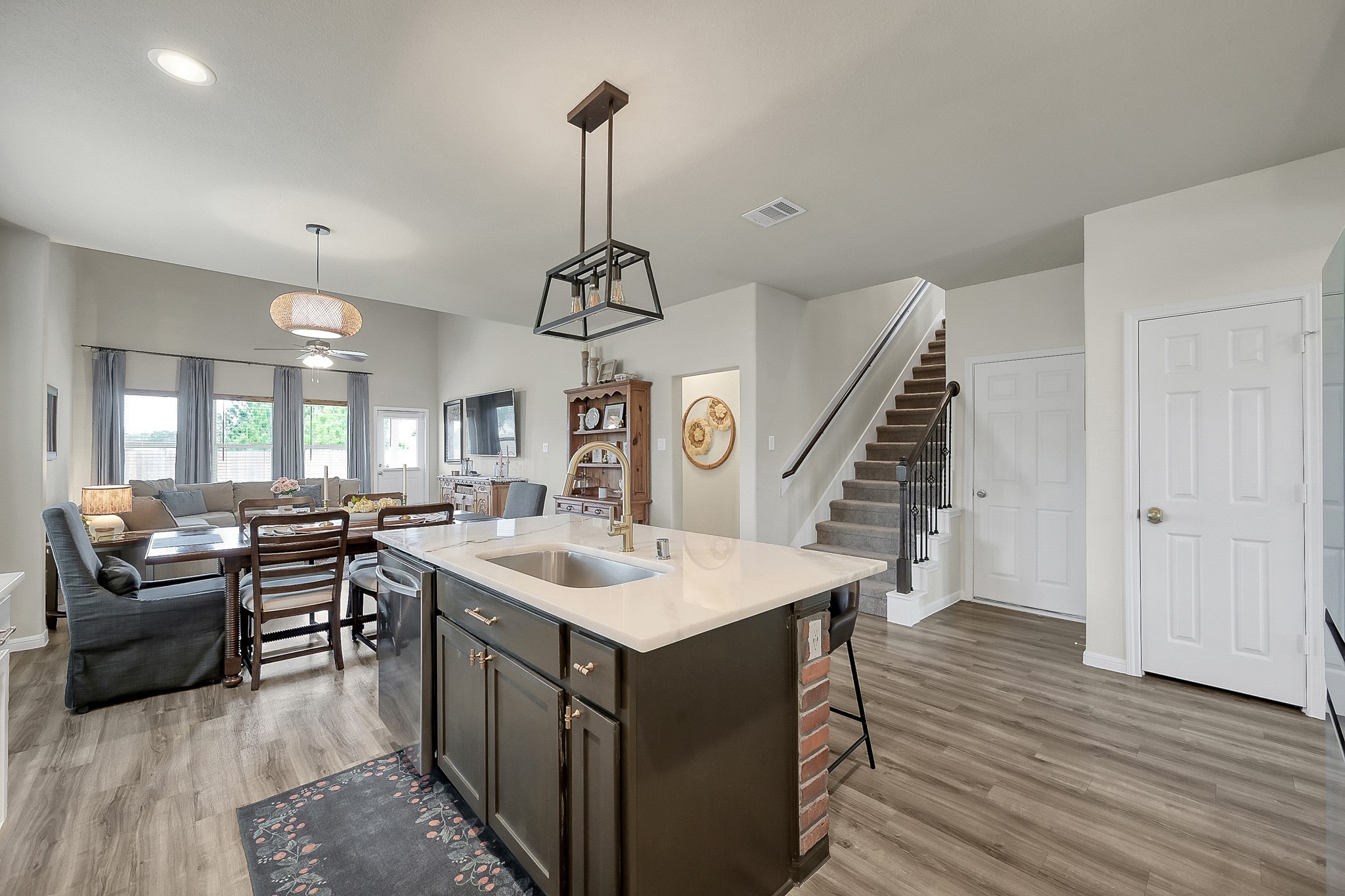 679 Red Elm Lane Conroe, TX 77304 - Photo 12 of 45 a very nice looking room with a wooden floor and furniture