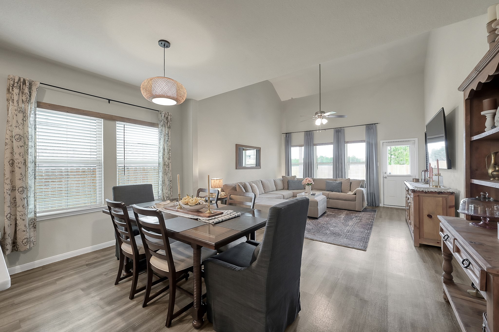 679 Red Elm Lane Conroe, TX 77304 - Photo 13 of 45 a view of a dining room with furniture window and wooden floor