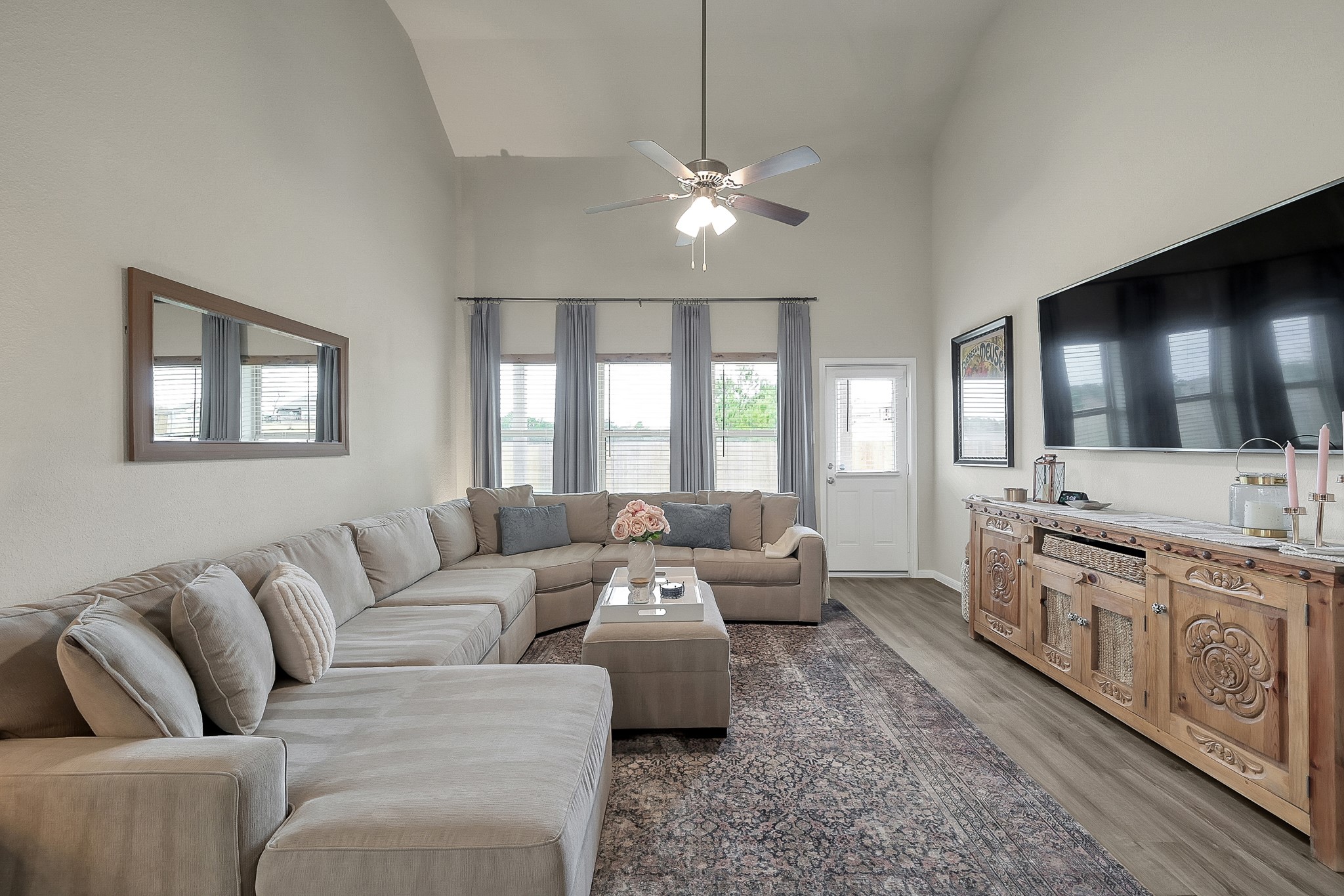 679 Red Elm Lane Conroe, TX 77304 - Photo 16 of 45 a living room with furniture a large window and flat screen tv