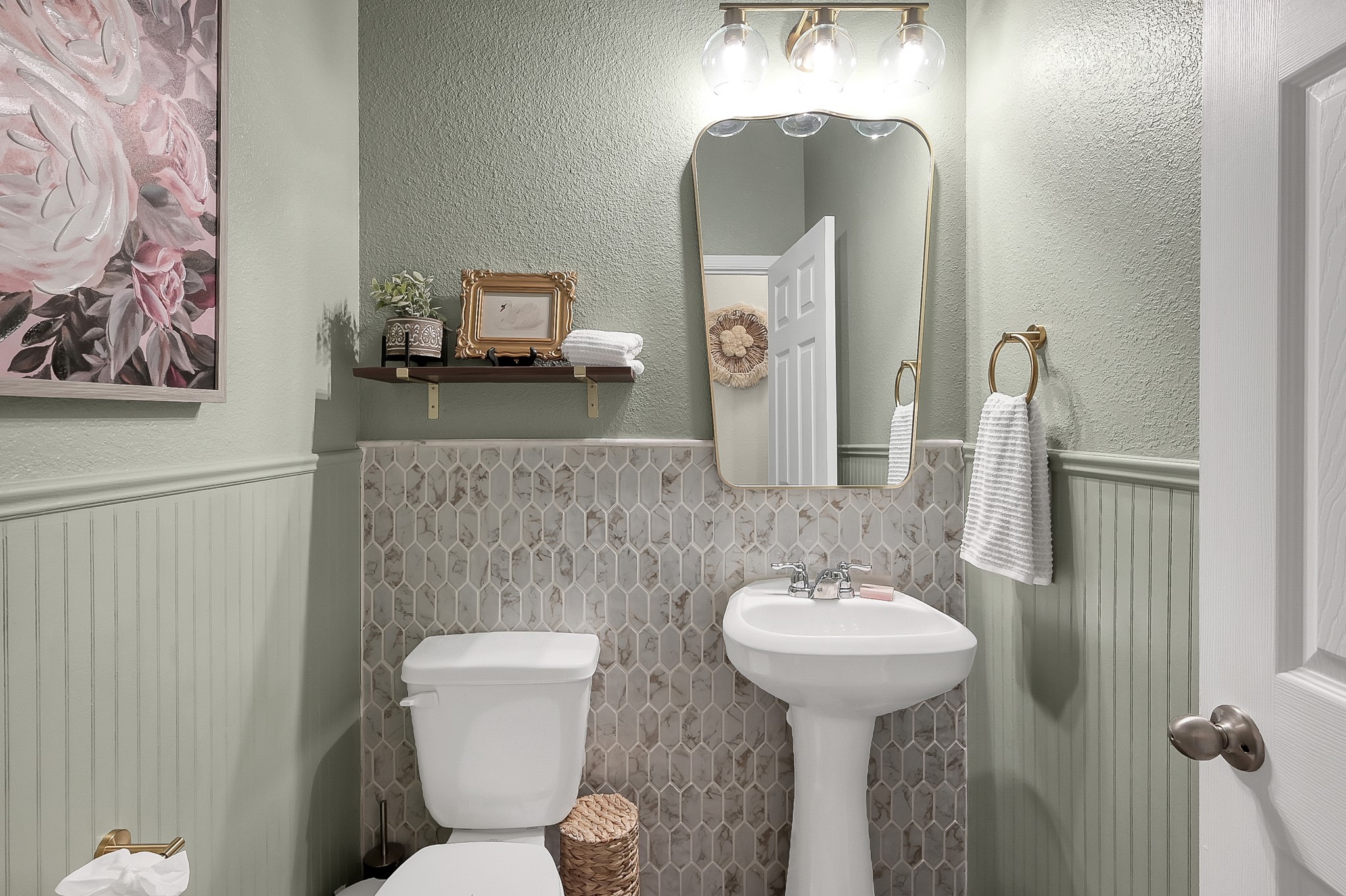 679 Red Elm Lane Conroe, TX 77304 - Photo 21 of 45 a bathroom with a toilet sink and mirror