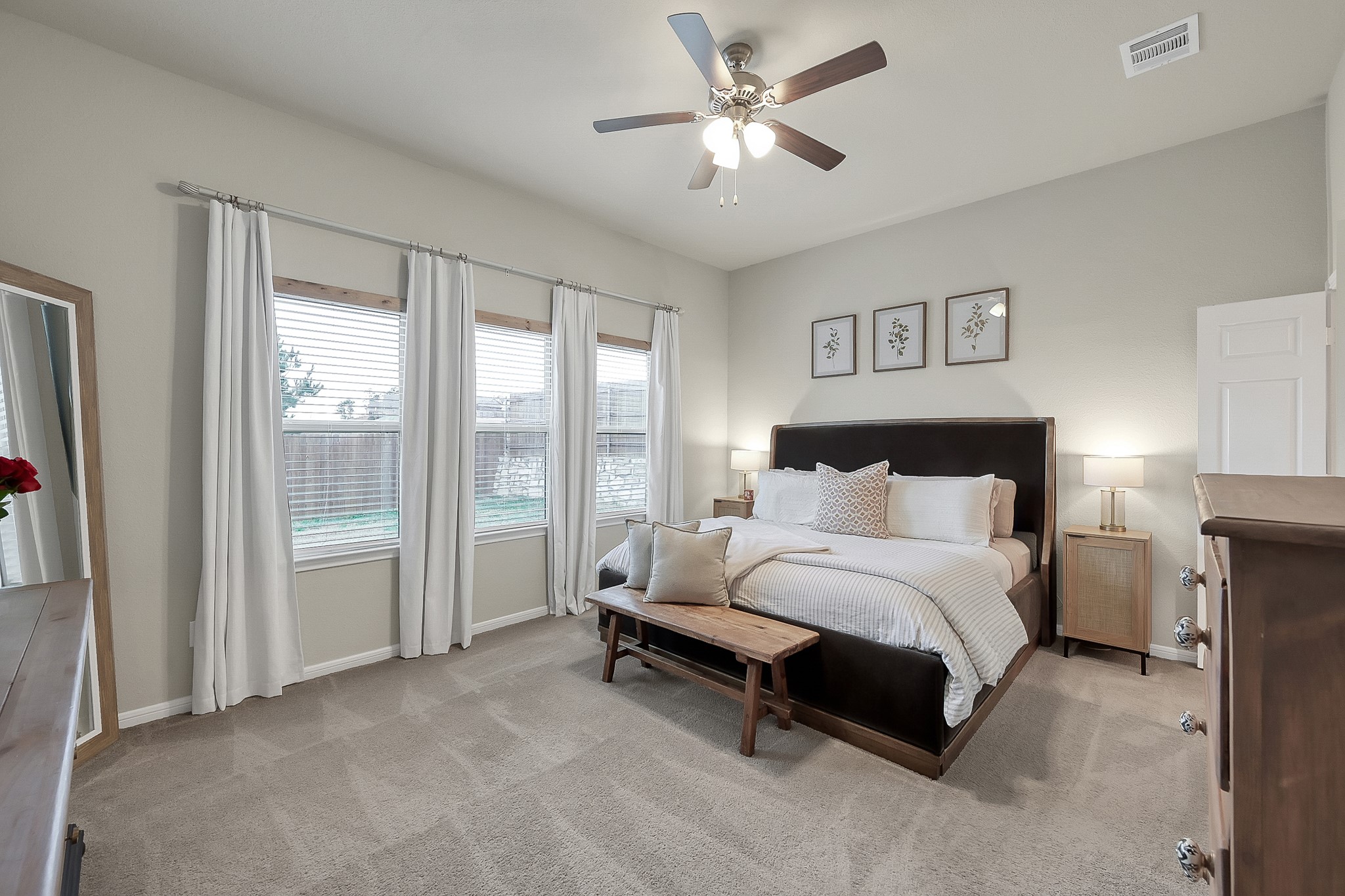 679 Red Elm Lane Conroe, TX 77304 - Photo 22 of 45 a spacious bedroom with a bed and a large window