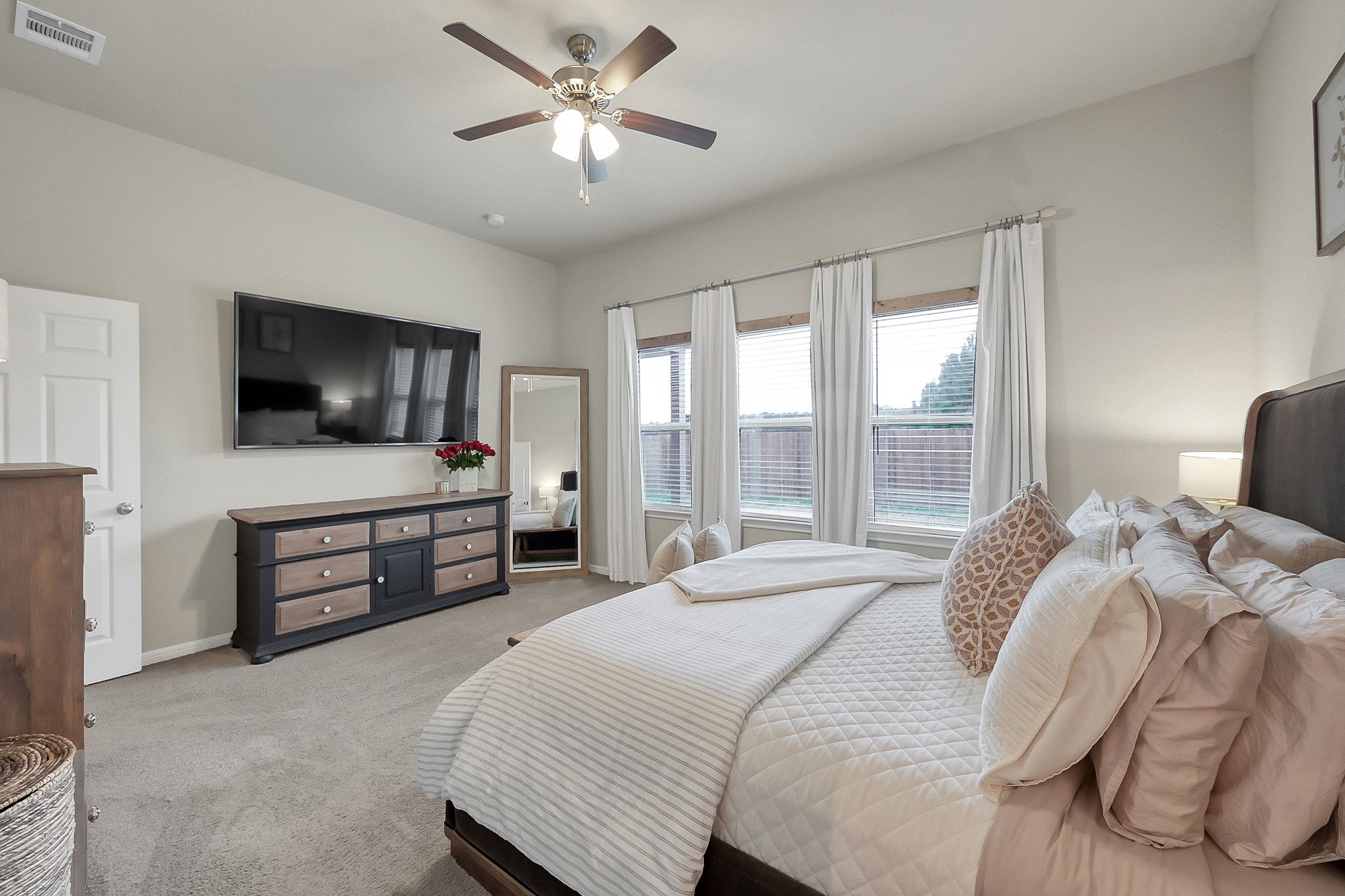 679 Red Elm Lane Conroe, TX 77304 - Photo 23 of 45 a bedroom with a bed and a flat screen tv