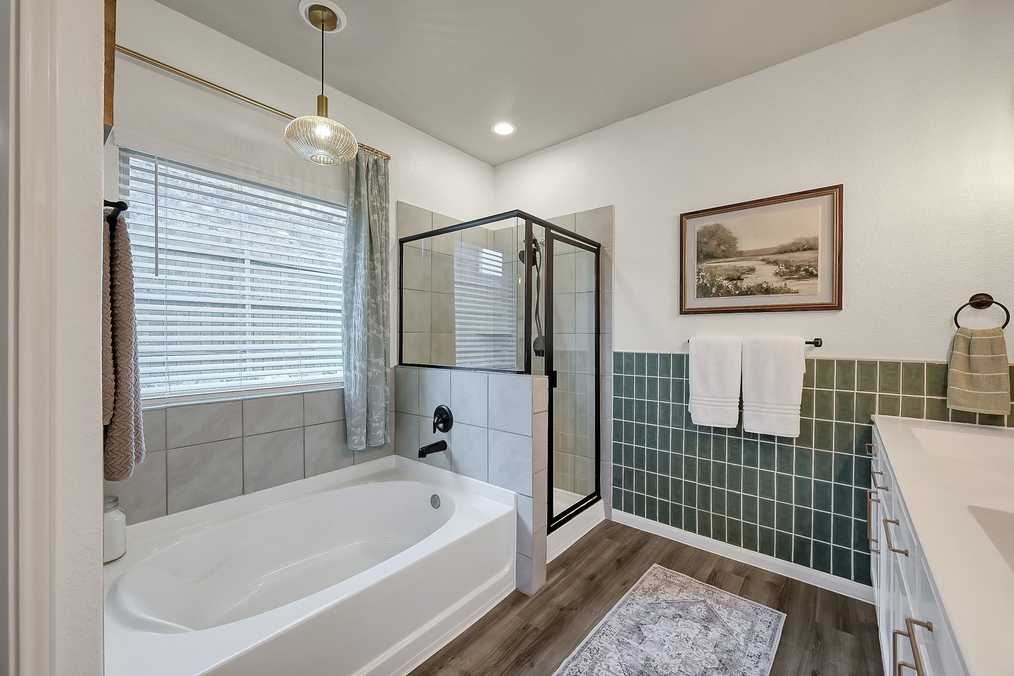 679 Red Elm Lane Conroe, TX 77304 - Photo 24 of 45 a bathroom with a bathtub a shower and a sink