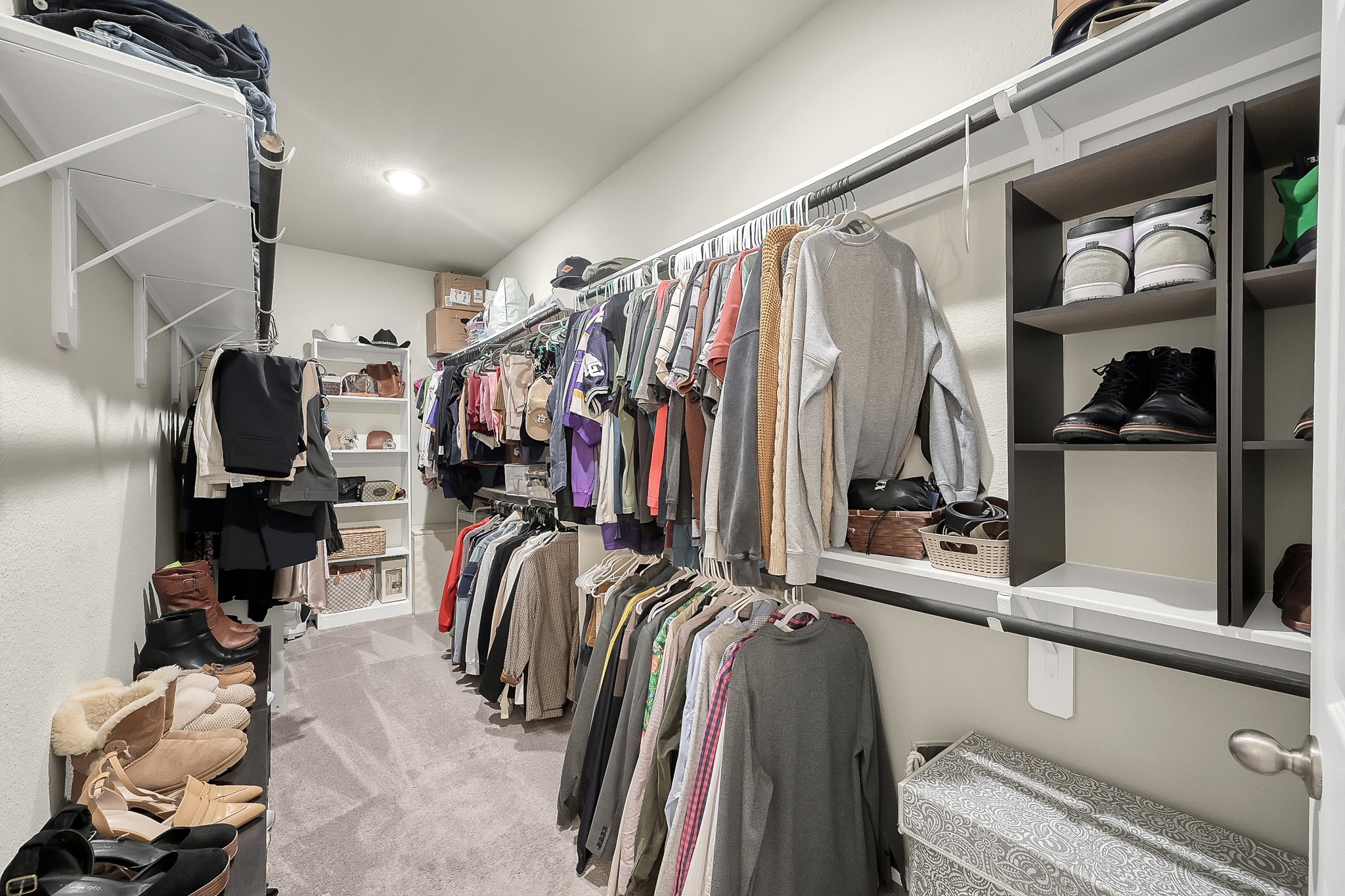 679 Red Elm Lane Conroe, TX 77304 - Photo 26 of 45 a view of walk in closet with clothes and shoes