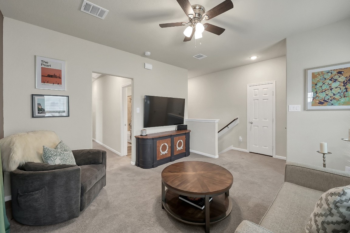 679 Red Elm Lane Conroe, TX 77304 - Photo 28 of 45 a living room with furniture and a flat screen tv