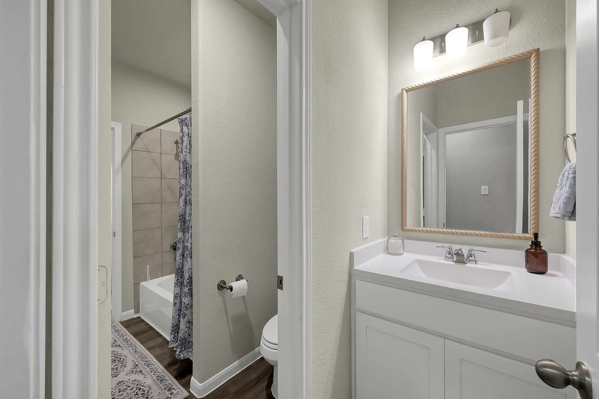 679 Red Elm Lane Conroe, TX 77304 - Photo 29 of 45 a bathroom with a sink and mirror