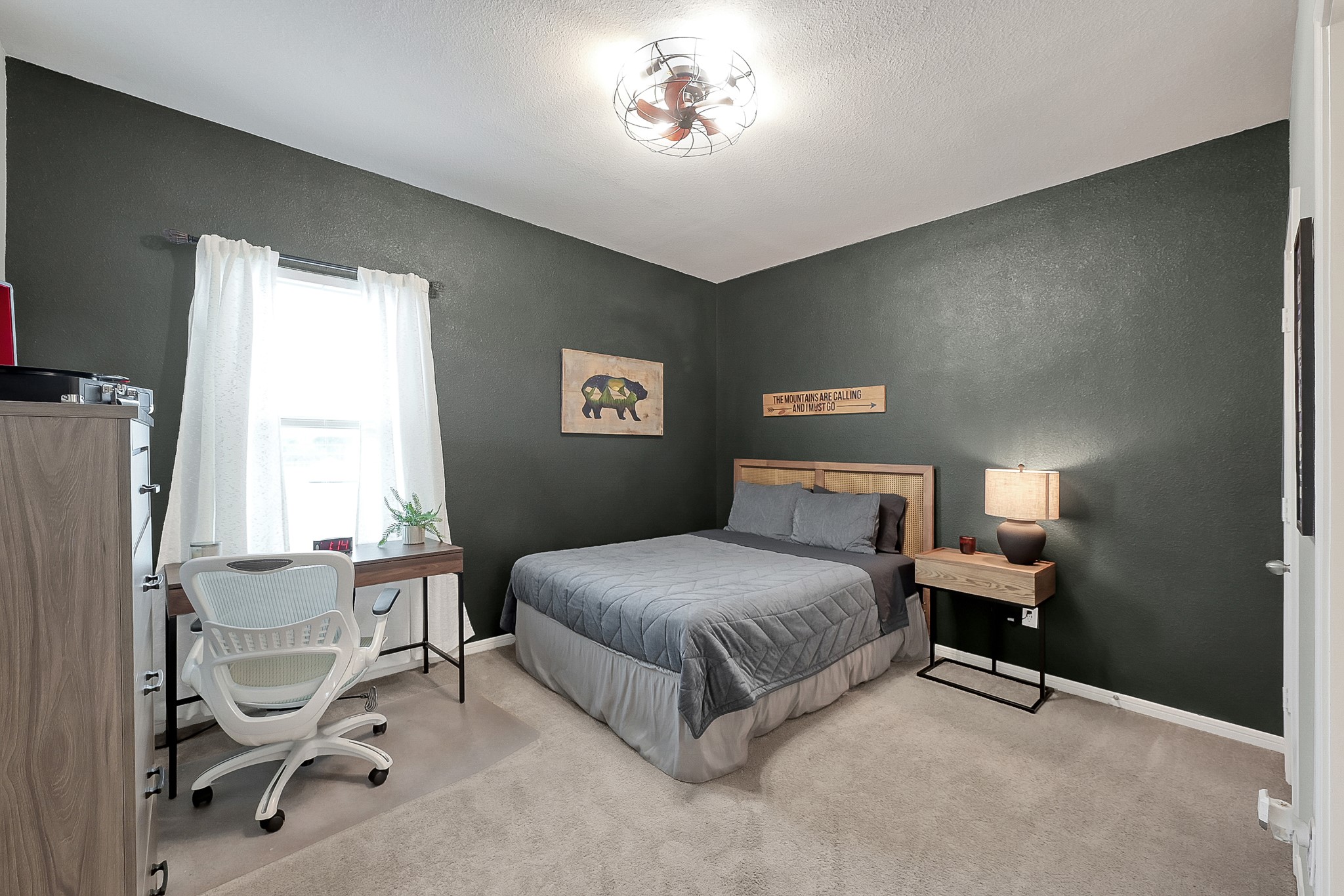 679 Red Elm Lane Conroe, TX 77304 - Photo 32 of 45 a bedroom with a bed and a chair