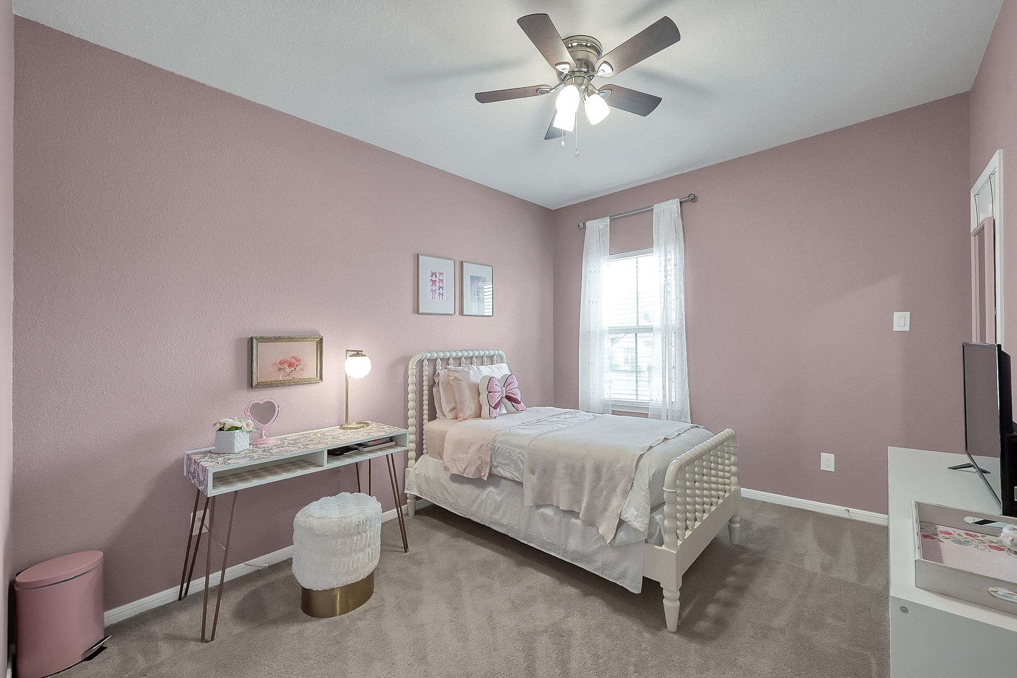 679 Red Elm Lane Conroe, TX 77304 - Photo 33 of 45 a bedroom with a bed and a chandelier