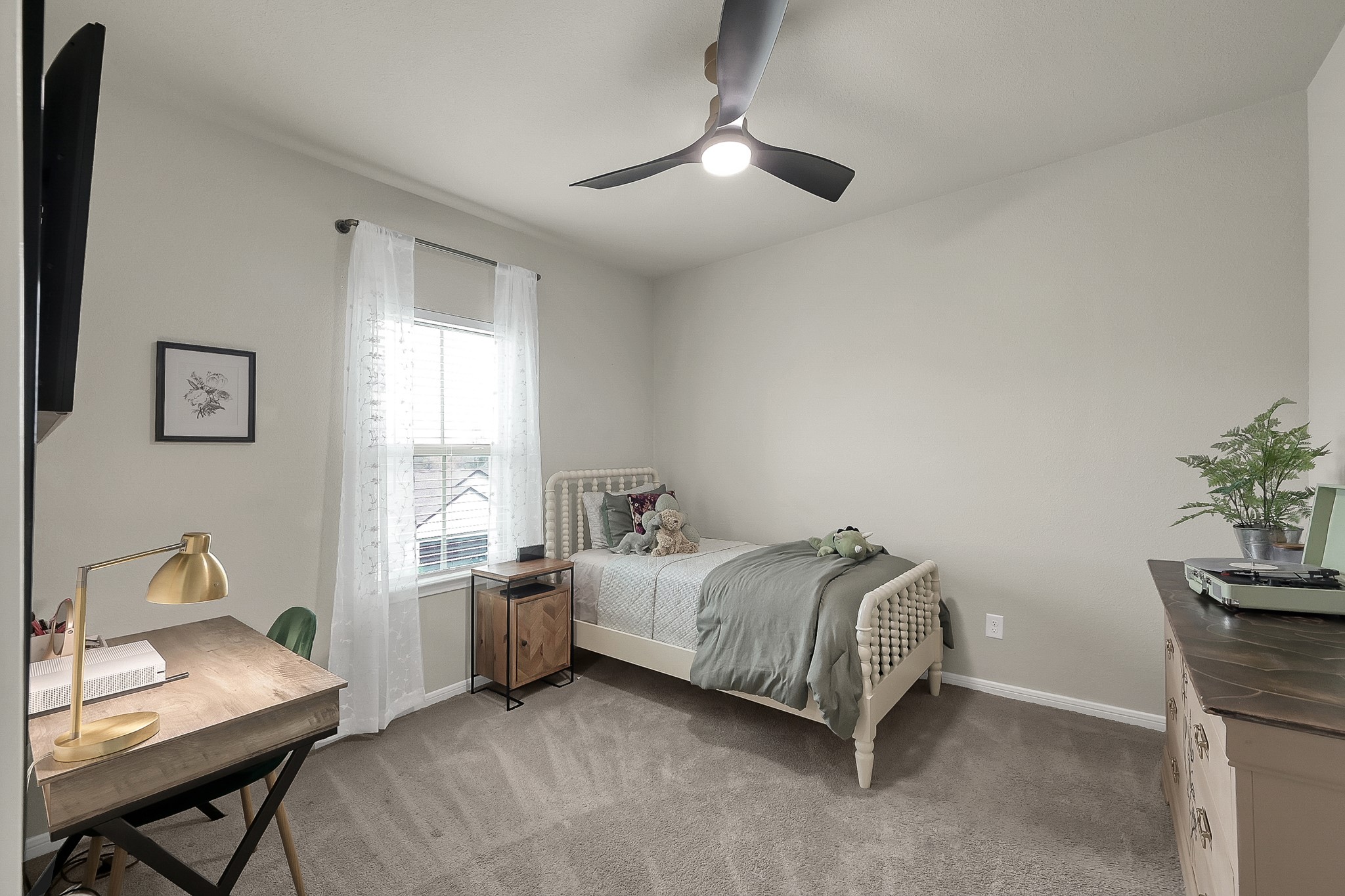 679 Red Elm Lane Conroe, TX 77304 - Photo 35 of 45 a bedroom with a bed and a window