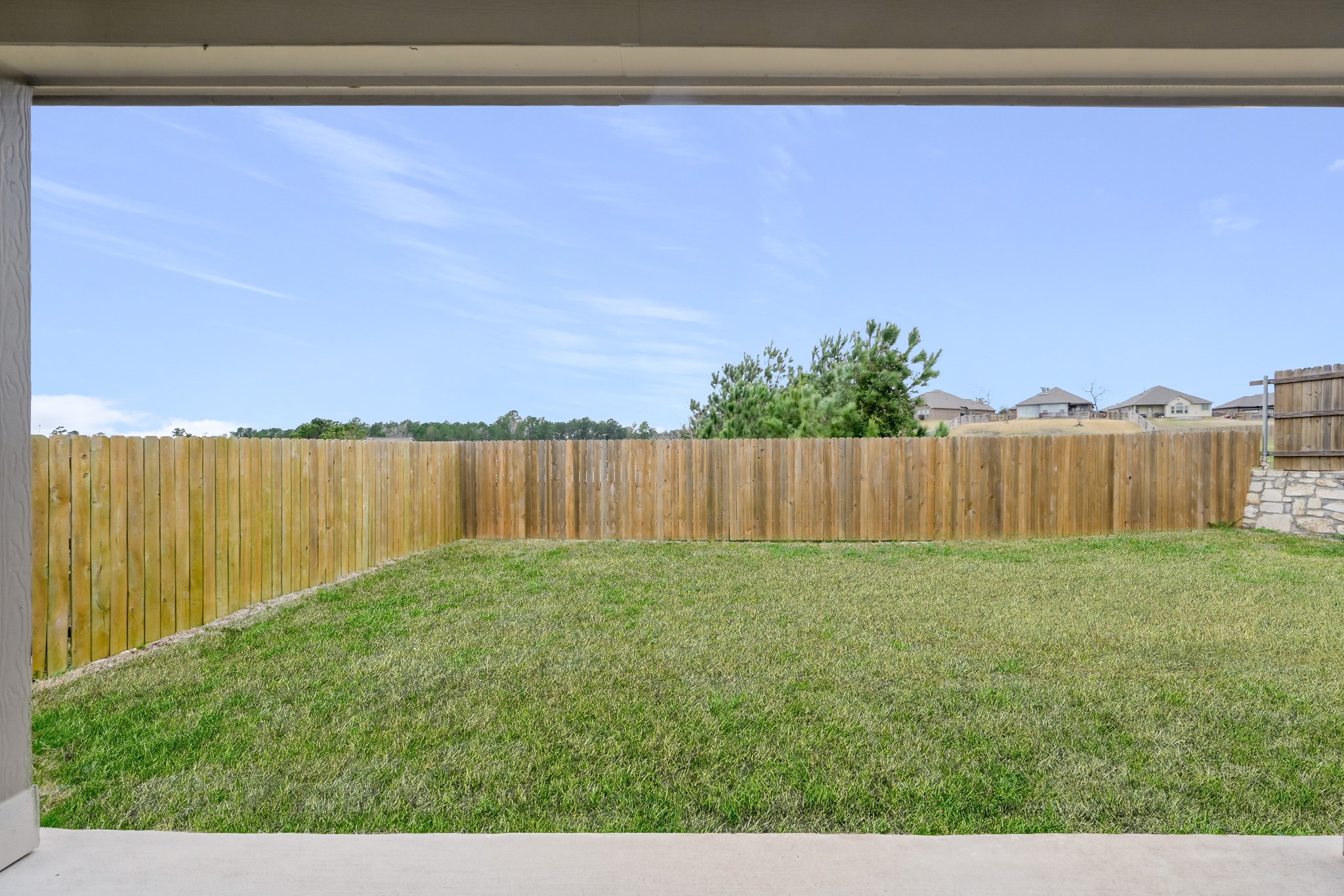 679 Red Elm Lane Conroe, TX 77304 - Photo 37 of 45 a view of a yard with an outdoor space and seating area