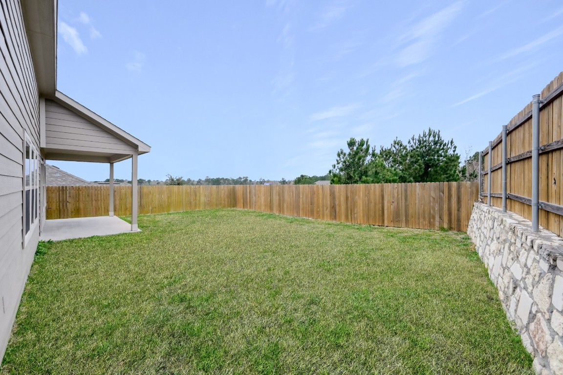 679 Red Elm Lane Conroe, TX 77304 - Photo 40 of 45 a view of backyard with green space