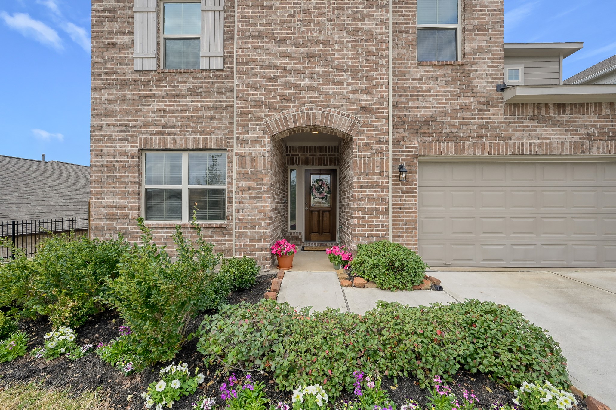 679 Red Elm Lane Conroe, TX 77304 - Photo 4 of 45 a front view of a house with plants