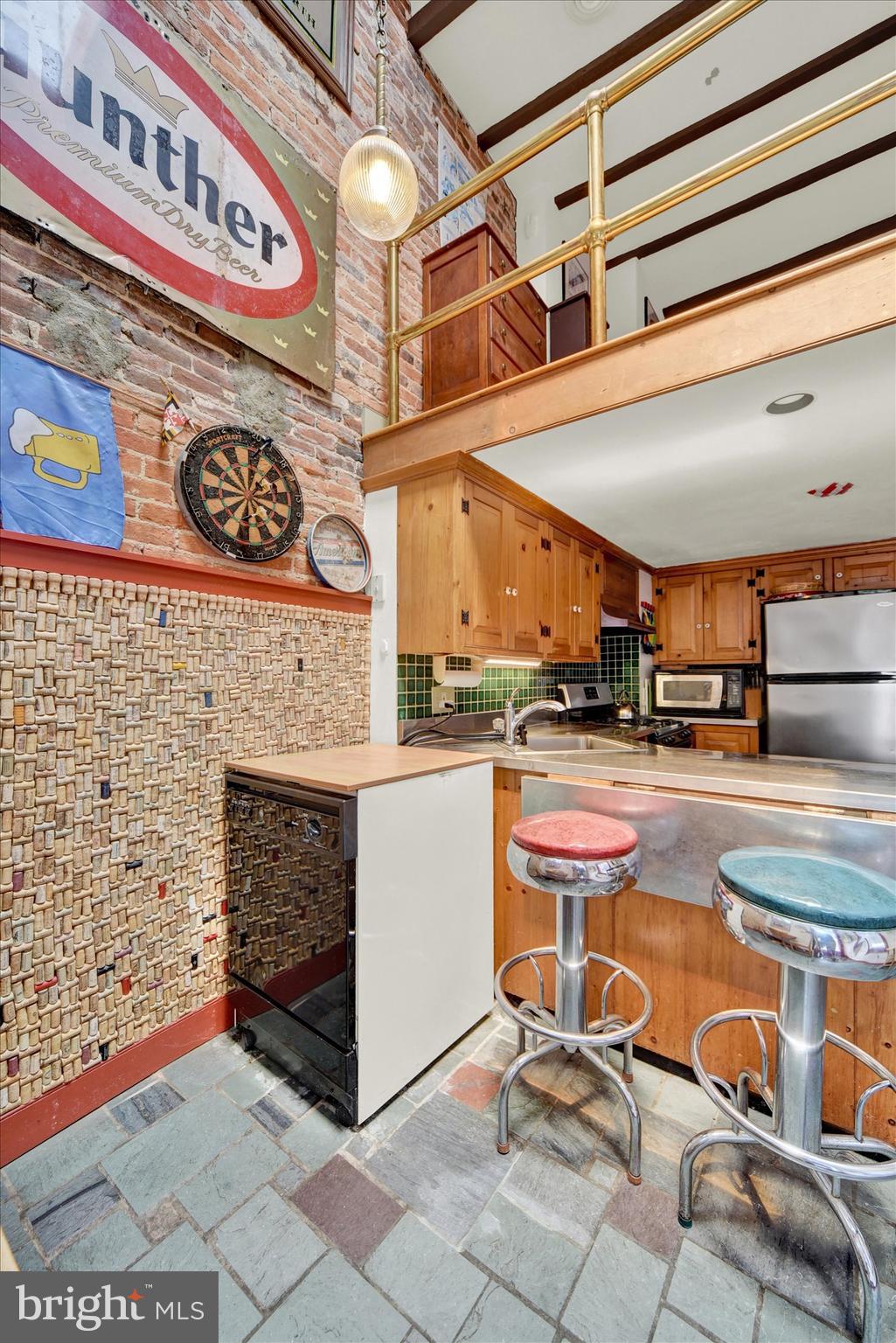 1611 Lancaster Street Baltimore, MD 21231 - Photo 12 of 43 a room with table and chairs