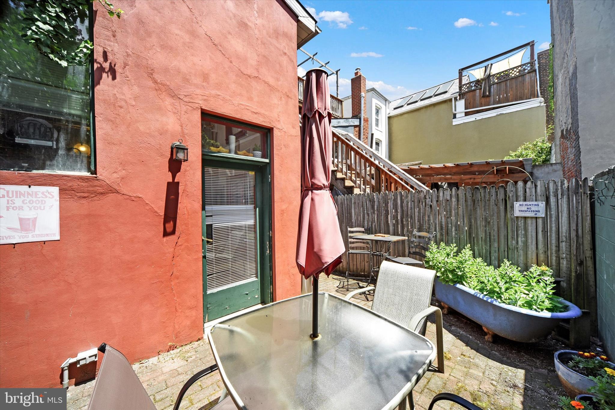 1611 Lancaster Street Baltimore, MD 21231 - Photo 24 of 43 a view of a chairs and table in the back yard of the house