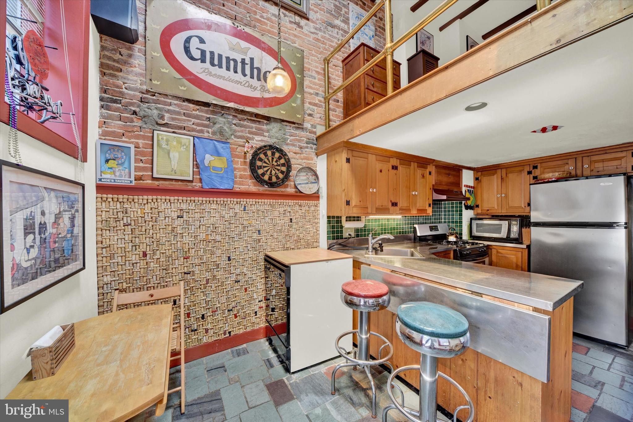 1611 Lancaster Street Baltimore, MD 21231 - Photo 10 of 43 a dining room with furniture and a clock