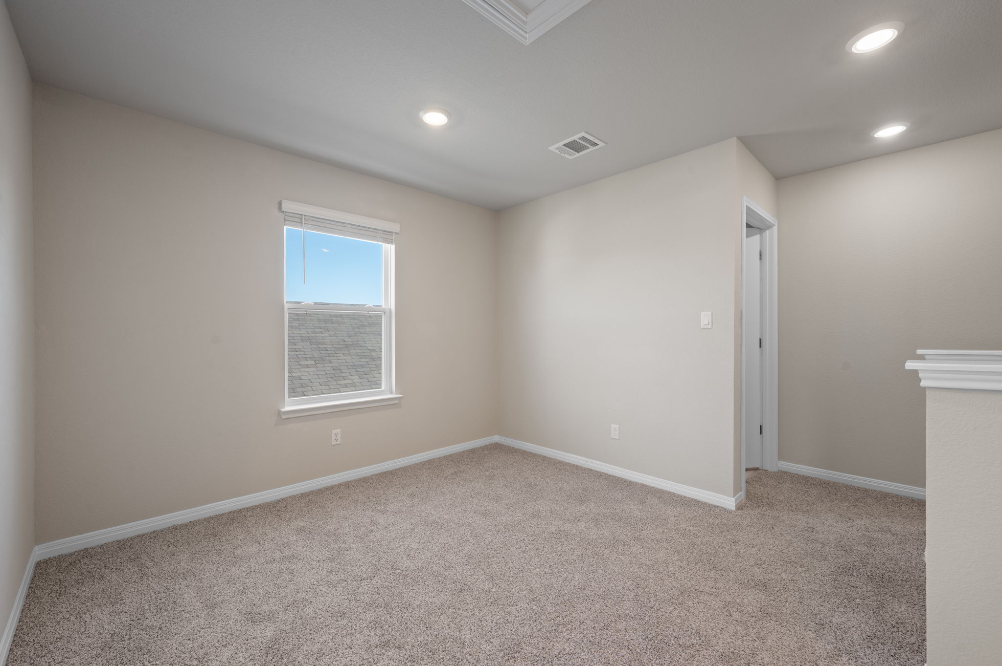 529 View Drive Georgetown, TX 78628 - Photo 11 of 20 Unfurnished room featuring light carpet and recessed lighting