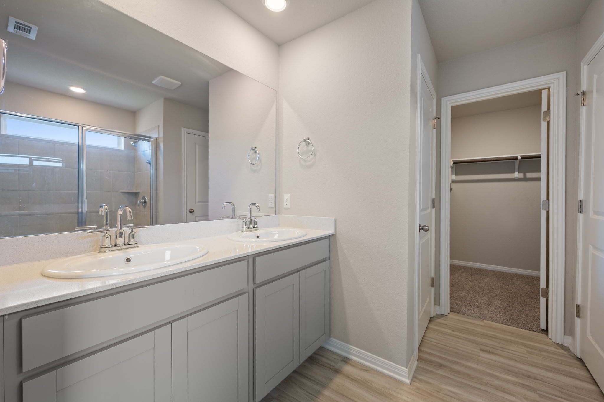 529 View Drive Georgetown, TX 78628 - Photo 15 of 20 Full bathroom featuring double vanity, a stall shower, a spacious closet, light wood finished floors, and recessed lighting