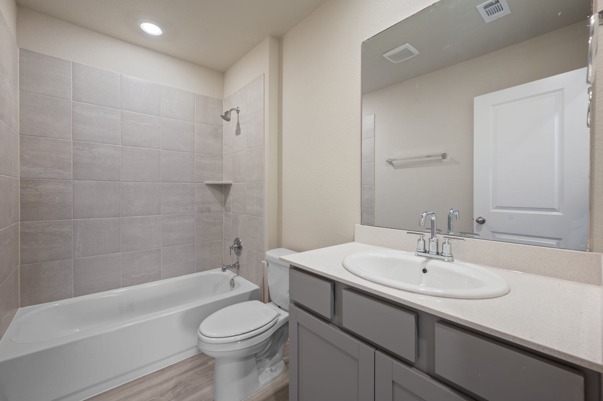 529 View Drive Georgetown, TX 78628 - Photo 16 of 20 Bathroom with vanity, bathing tub / shower combination, light wood-style flooring, and recessed lighting