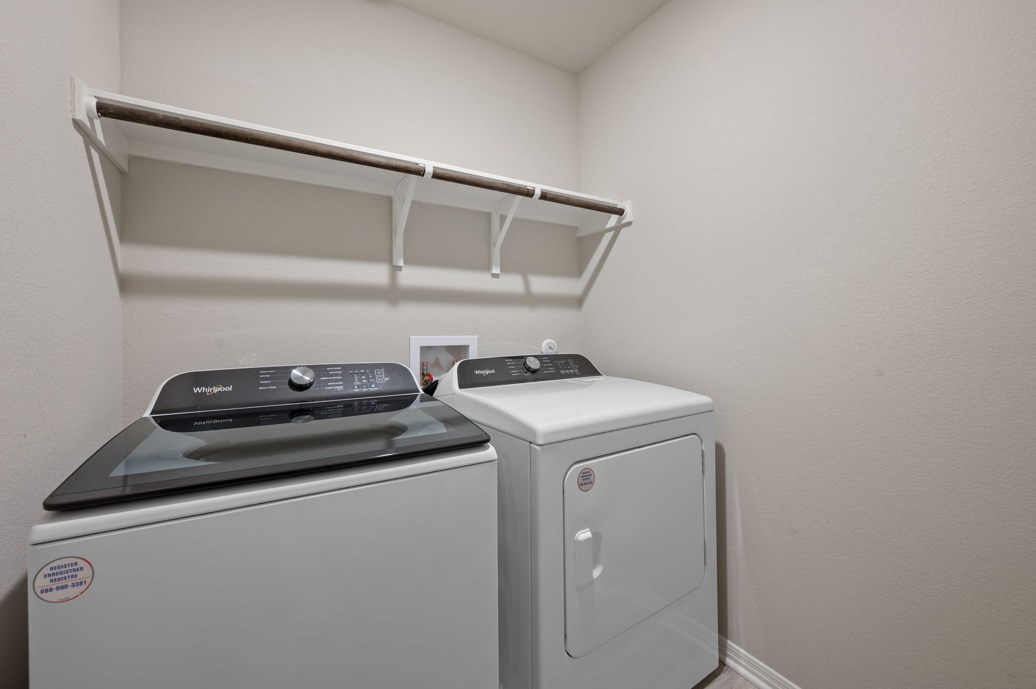 529 View Drive Georgetown, TX 78628 - Photo 18 of 20 Laundry area featuring washing machine and clothes dryer and baseboards