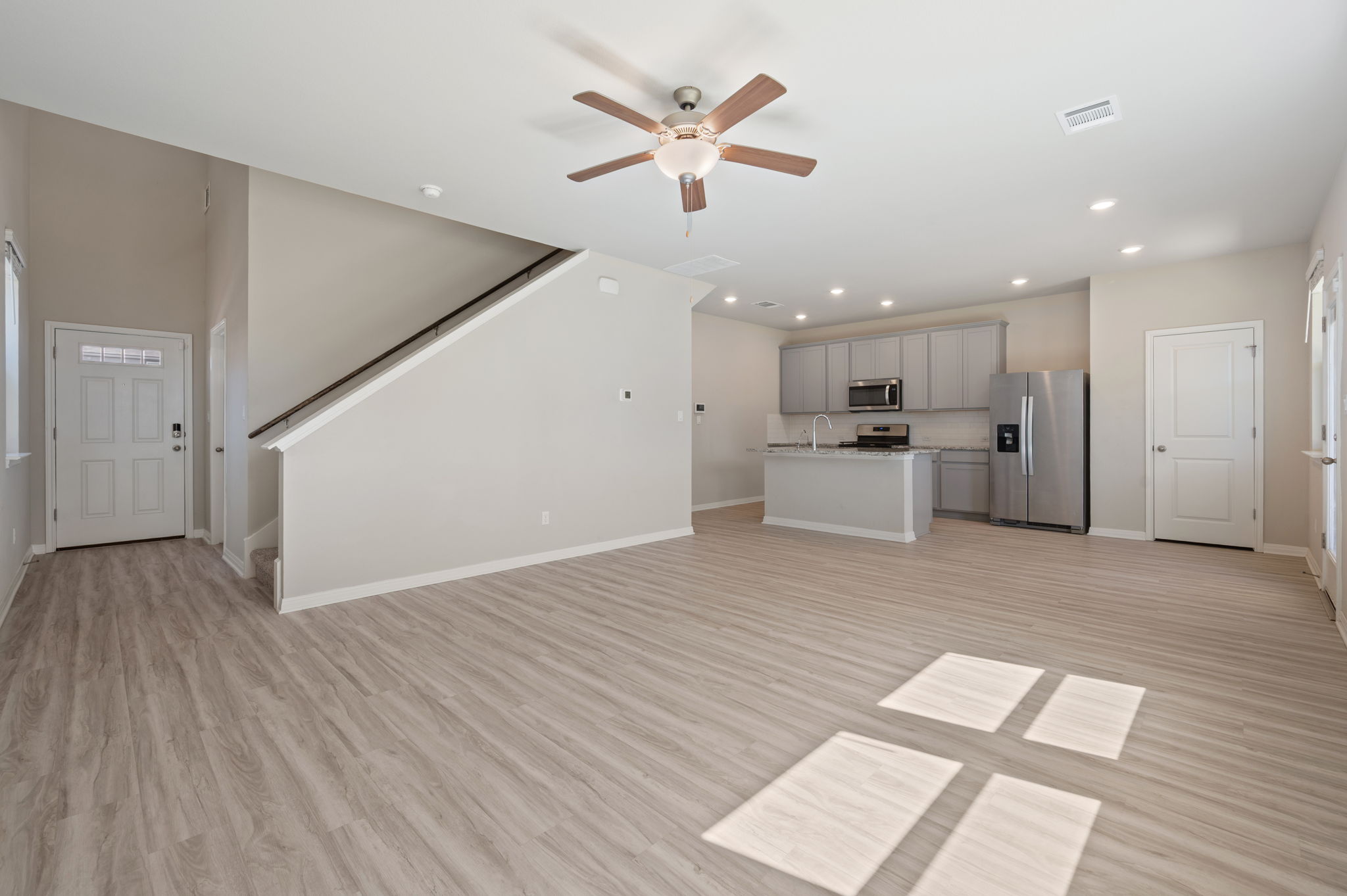 529 View Drive Georgetown, TX 78628 - Photo 3 of 20 Unfurnished living room with a ceiling fan, light wood-type flooring, and recessed lighting