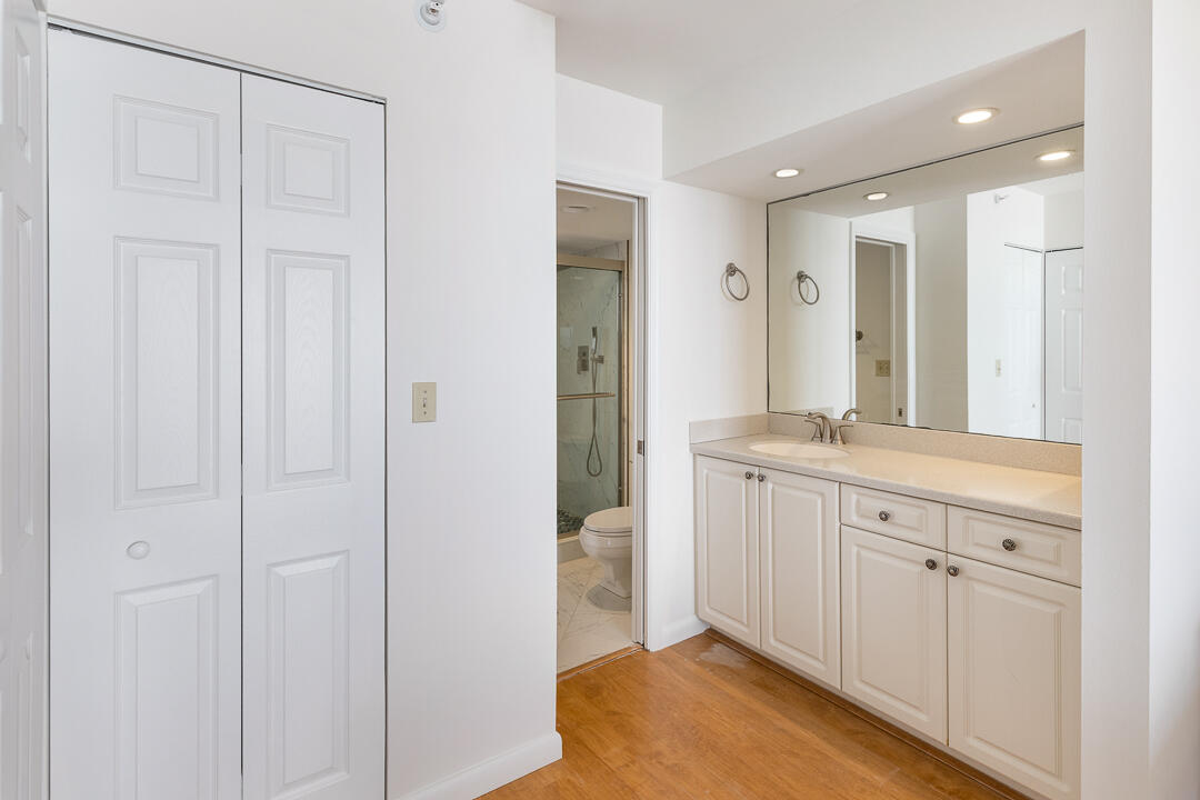 400 Ocean Trail Way, Unit 1108 Jupiter, FL 33477 - Photo 19 of 41 a spacious bathroom with a granite countertop sink and a mirror